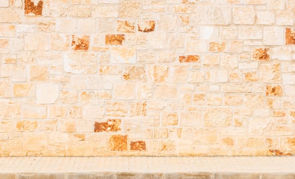 Background scene of vintage stone wall with sidewalk and copy space