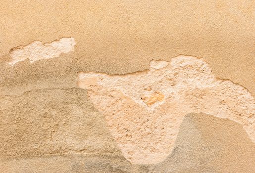 Close-up of old damaged wall plaster background texture