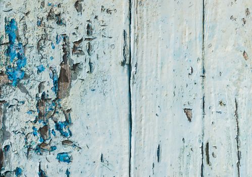 Vintage blue wood background texture with peeling paint