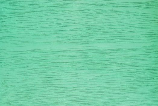Surface of green colored wood background texture with copy space