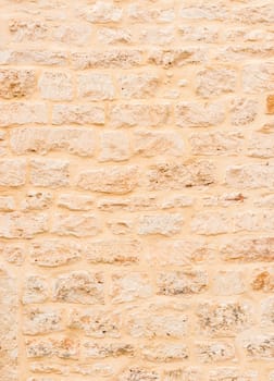 Vintage light brown stone wall background texture 

