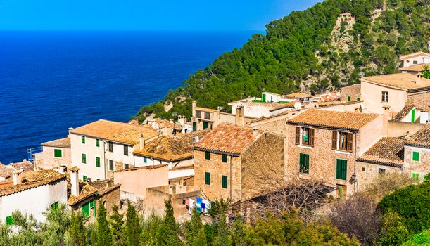 Coastline on Mallorca island with view of the mediterranean old village of Banyalbufar, Spain