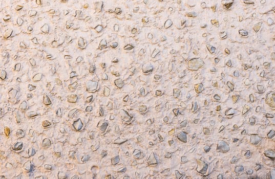 Natural grey vintage stone wall background texture, close-up