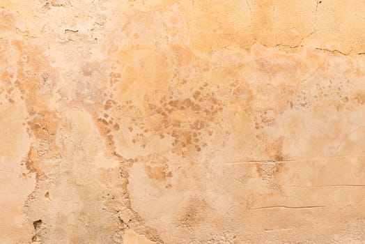 Vintage colored wall background with rustic weathered plaster texture