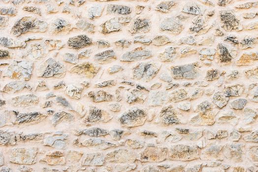 Gray stone wall background texture, structure close-up