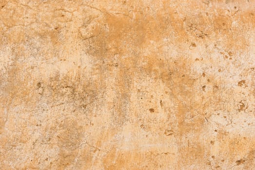 Vintage colored wall background with rustic weathered plaster texture