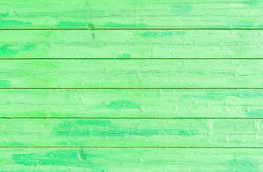 Green colored wooden planks backdrop texture with copy space