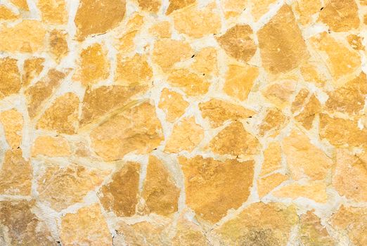 Rustic brown stone wall texture background structure