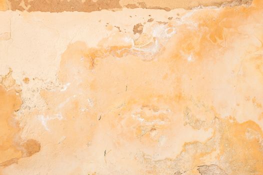 Old rustic damaged plaster wall backdrop texture, close-up