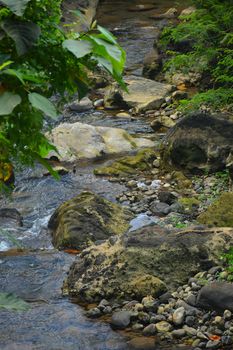 Daranak river current with surrounding rocks in Tanay, Rizal, Philippines.