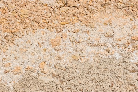 Vintage rustic stone wall backdrop texture, close-up