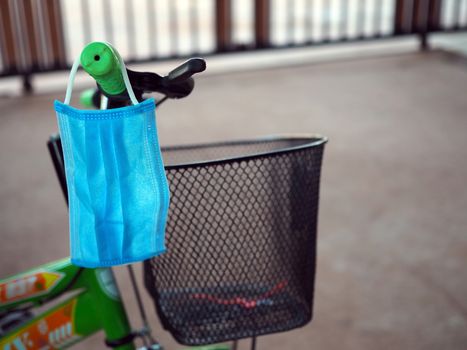 Face mask Hanging from the bike to be ready at all times At an unusual time. new normal concept. COVID-19.