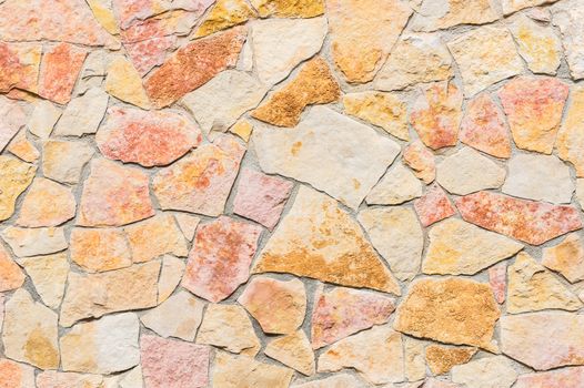 Rustic stone wall multicolored background texture 
