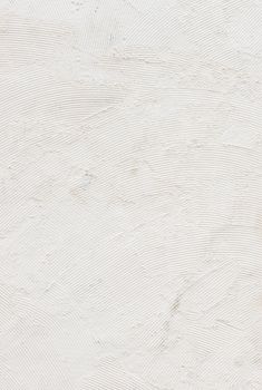 White raw plastered wall background texture with copy space