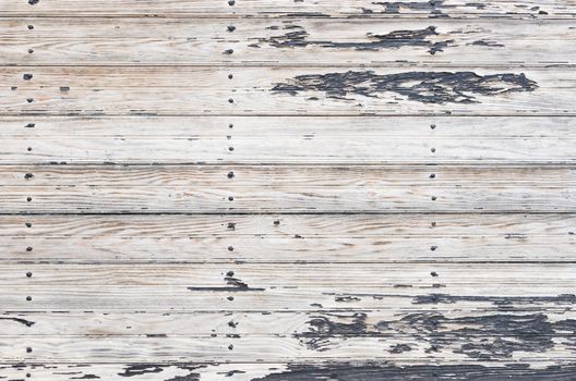 Grungy white and gray wooden boards backdrop texture with copy space