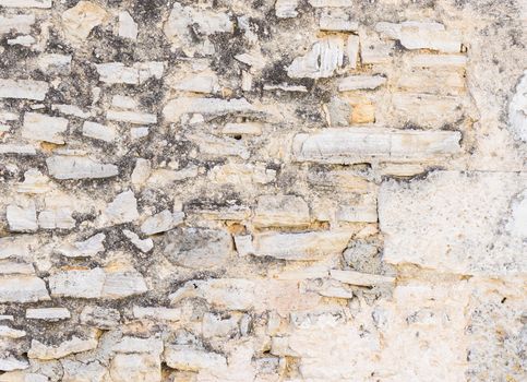 Grunge old stone wall backdrop texture, close-up