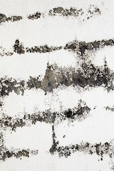 Old white cracked cement concrete wall distressed grunge texture background