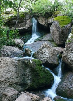 Waterfall Kuk-Karauk in forest, Bashkortostan in Russia