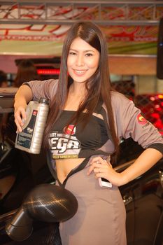 MANDALUYONG, PH - APR. 19: Phoenix vega motor oil female model at Trans Sport Show on April 19, 2012 in Megatrade Hall, Mandaluyong, Philippines.