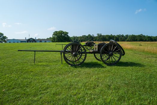 A wide angle photo of a caisson in the field at Battlefield National Park in Manassas, the site of the Battle of Bull Run.