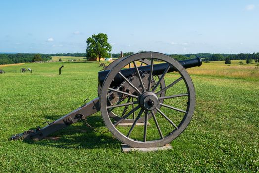Wide angle photo of a cannon in Battlefield National Park, site of the Battle of Bull Run in the Civil War.