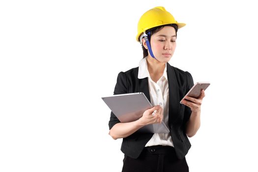 Young woman engineer holding digital tablet and using mobile phone isolated on white background