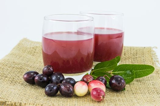 fresh Carissa carandas glass of juice with Carissa carandas fruits and Healthy drinks concept

