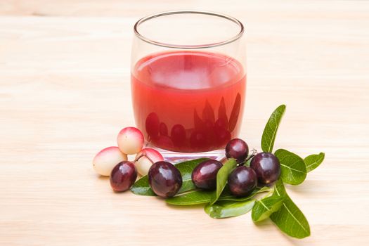 fresh Carissa carandas glass of juice with Carissa carandas fruits and Healthy drinks concept

