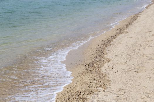 Sea soft wave and sand beach