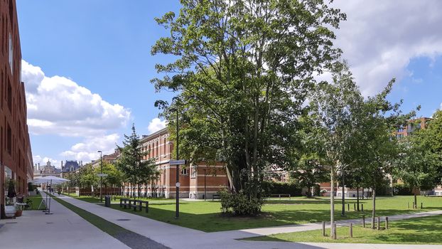 Antwerp, Belgium, July 2020: View on the Artsen Zonder Grenzenstraat in Groen Kwartier, formerly military hospital and now renovated residential area.