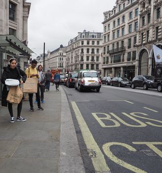 LONDON, UK - CIRCA SEPTEMBER 2019: People in Regent Street