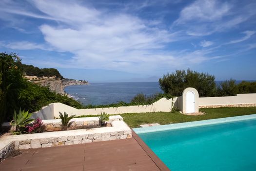 A small house with a swimming pool on the shores of the Mediterranean Sea. Accommodation in Spain.