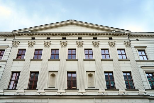 A fragment of a classical facade of the historic building in Poznan