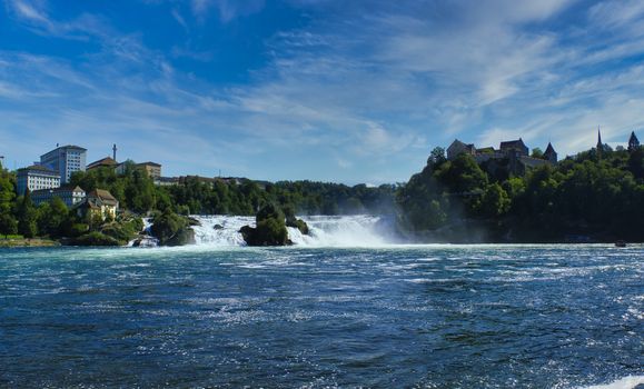 the famous rhine falls in the swiss near the city of Schaffhausen - sunny day and blue sky