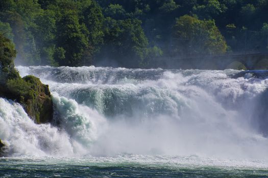 the famous rhine falls in the swiss near the city of Schaffhausen - sunny day and blue sky