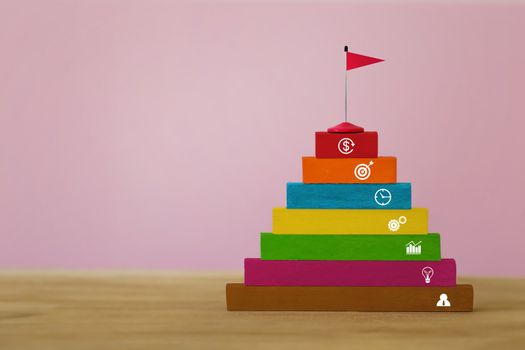 Staircase to success concept : Arrange red flag on stair step go to Trophy and success. depicts planning the structure of the operation To reach the goal