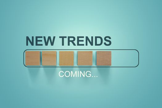 Wooden blocks with the word NEW TRENDS coming in loading bar progress. The concept of new ideological trends of fashion. New objectives.  Recent and latest trend. Main trend of changes in the world.