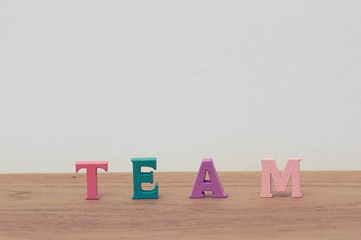 Teamwork /confidence concept: Arrange the letters of word "TEAM" Working together for more than 1 member. The team successful at work is a group of people working together to achieve goals.