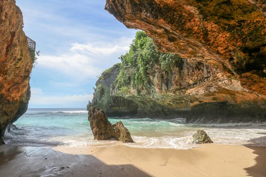 Suluban beach, Bali, Indonesia. Nature vacation background. Colorful sunrise on the rocky coast. Rocs on the beach. Blue ocean. Happy holiday. Vacation