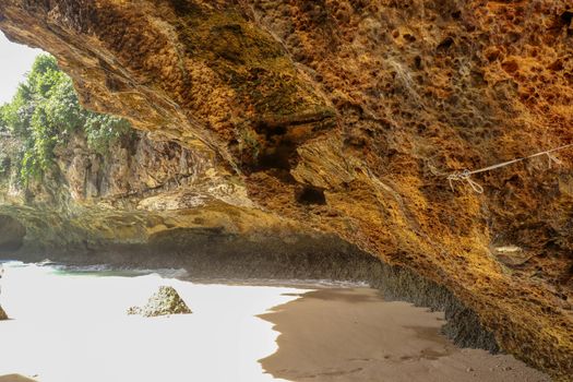 Suluban beach, Bali, Indonesia. Nature vacation background. Colorful sunrise on the rocky coast. Rocs on the beach. Blue ocean. Happy holiday. Vacation