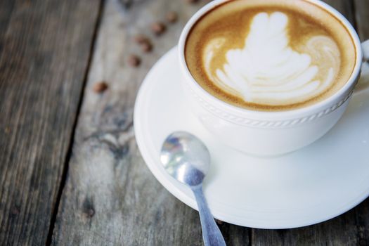 Coffee cup of closeup on wooden table with background.