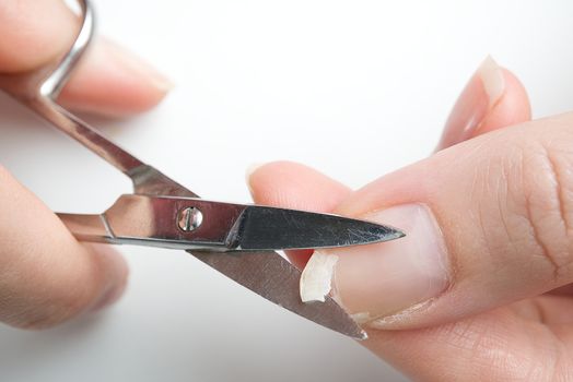 broken nail on a female hand. close-up shoot of broken nail