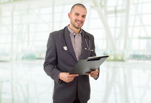 happy male doctor, at the hospital