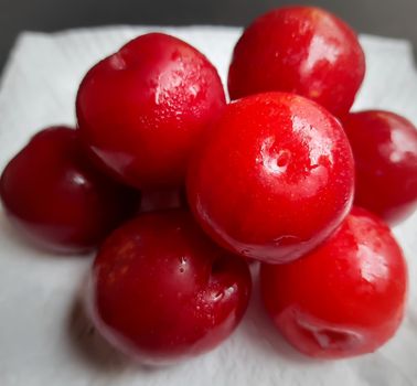 Colorful Red plums placed in white background and reduce the risk of cancer heart disease and diabetes