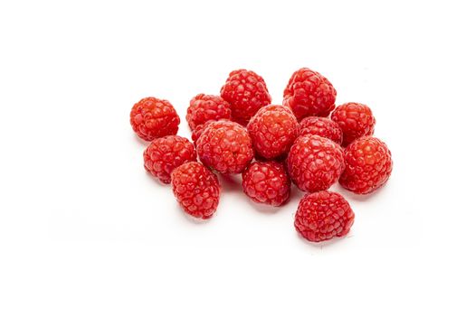 Fresh ripe raspberries isolated on white background.