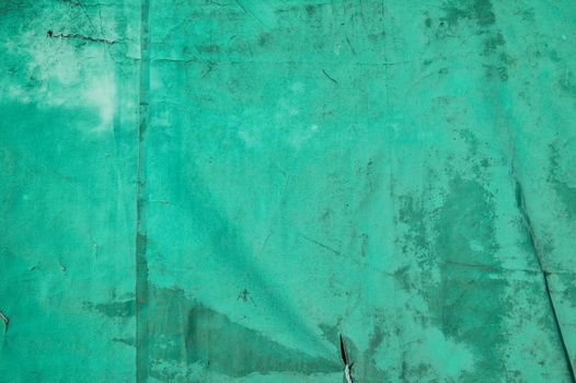 Old distressed green canvas cover texture background