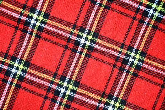 Red Scottish tartan plaid fabric material pattern background