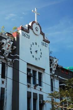 MANILA, PH - FEB 16 - San Juan de Letran college clock facade at Intramuros on February 16, 2013 in Manila, Philippines.