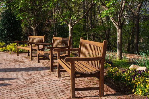 Photo of three empty park benches during lockdown in Reston Virginia.