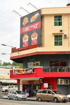 KOTA KINABALU, MY - JUNE 20: KFC Restaurant facade on June 20, 2016 in Kota Kinabalu, Malaysia. Kentucky Fried Chicken is a fast food restaurant chain that specializes in fried chicken in USA.
